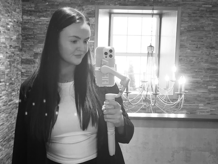 Black and white selfie of Fifteen Weddings & Events owner and wedding content creator Lianna
